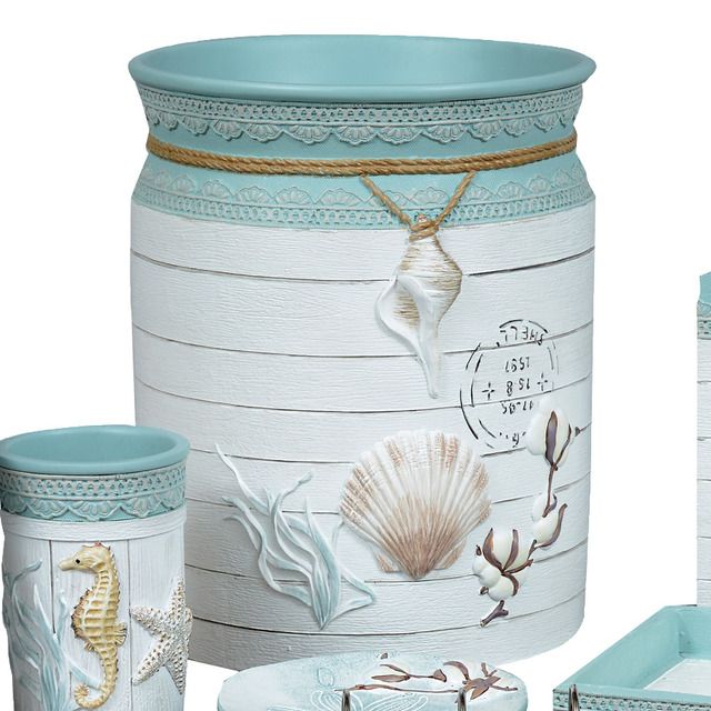 sea shells and seashells are painted on the side of this decorative storage container