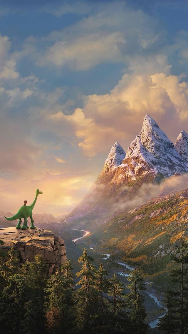 the good dinosaur is standing on top of a mountain