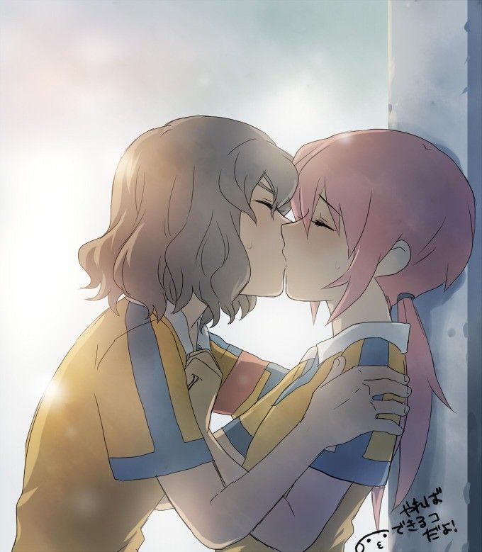 two anime characters kissing each other in front of a window with the sun behind them