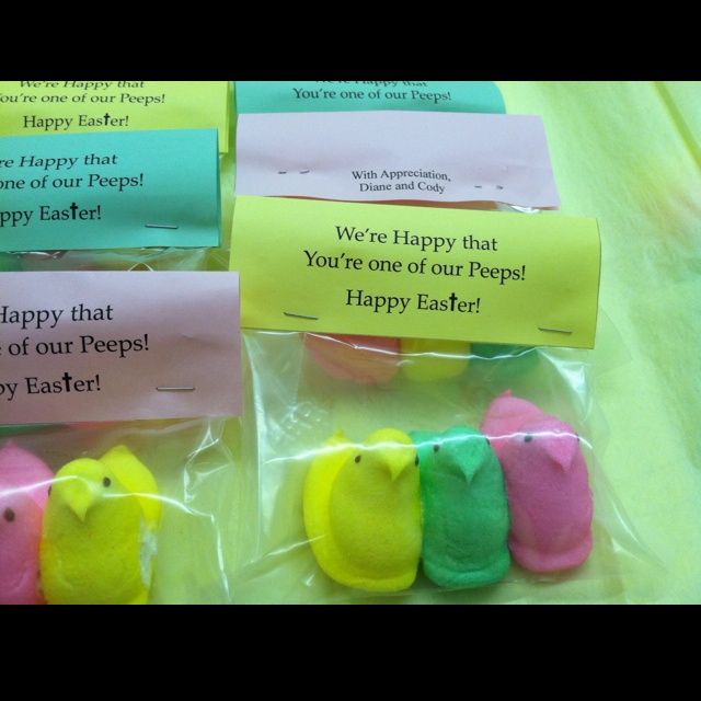 four peeps are wrapped in plastic bags and have happy messages on them for easter