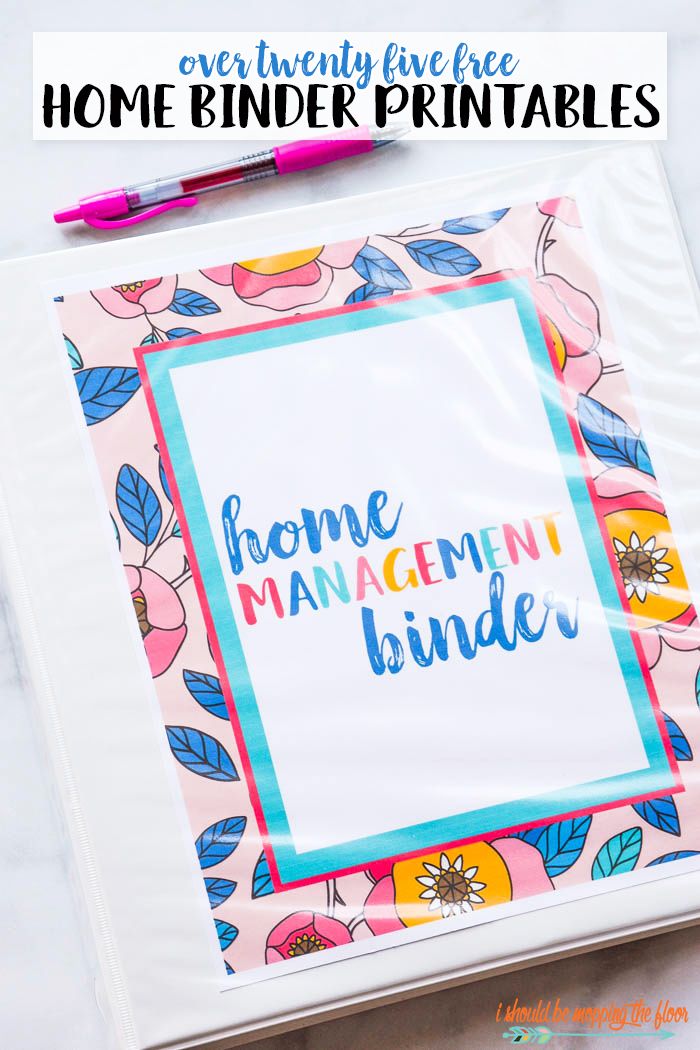 a binder with the words home management binder on it and a pink pen next to it