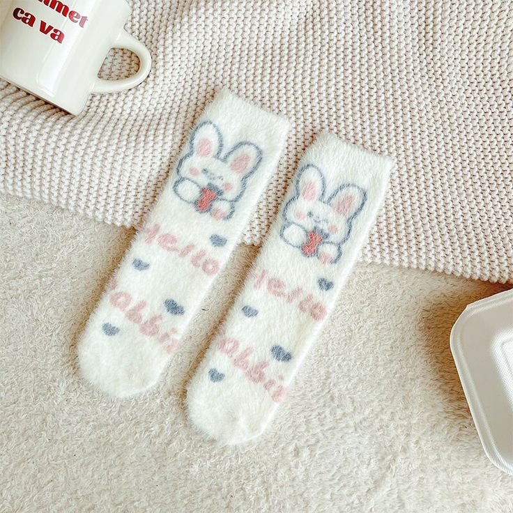 Elevate your sock game with our Sweet Bunny Socks, the epitome of kawaii cuteness for your feet. Here's what makes these socks a must-have: Key Features: Adorable Bunny Design: These kawaii socks feature an irresistibly cute bunny design that's sure to bring a smile to your face. With little bunny faces and floppy ears, they capture the essence of kawaii style. Comfortable Fit: Crafted from high-quality materials, these kawaii socks offer a comfortable and snug fit. They're perfect for everyday Cute White Non-slip Socks, Cute White Socks With Letter Print, Casual Warm Socks For Gift, Casual Warm Socks Gift, Casual Warm Socks For Gifts, Trendy Soft Socks For Stocking Stuffers, Cozy White Socks For Gifts, Cozy White Socks As Gift, Cozy White Socks As A Gift