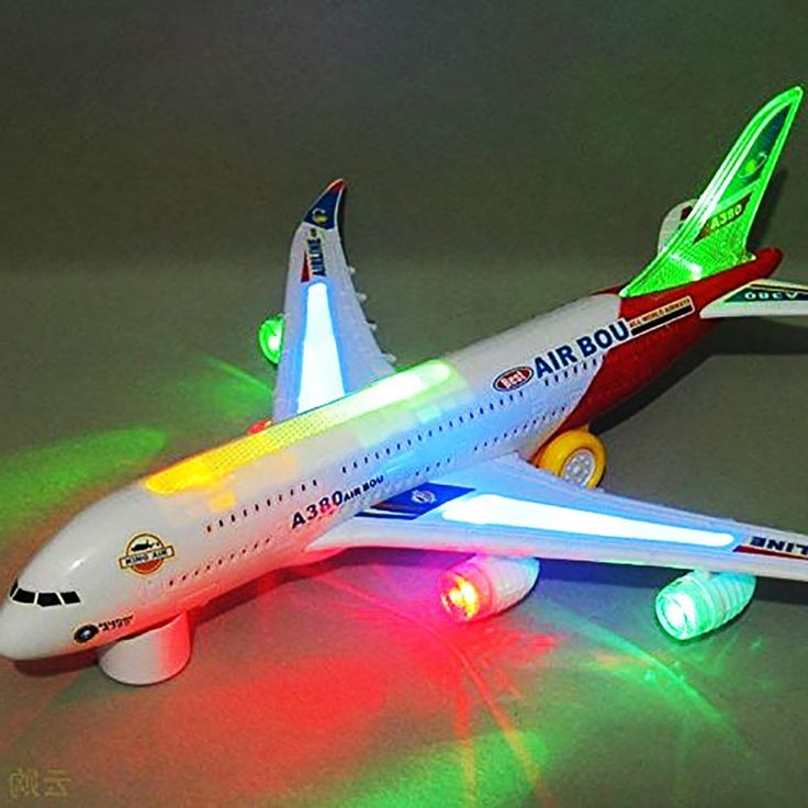 a toy airplane with its lights turned on