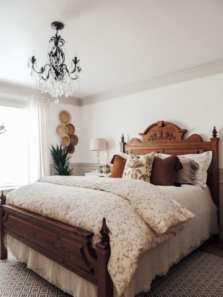 a bedroom with a bed and chandelier in it