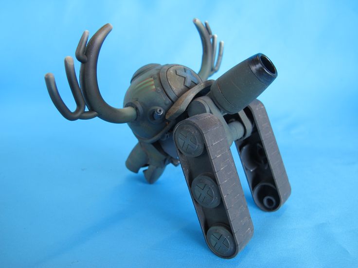 a toy figure made out of legos on a blue background with an antler's head