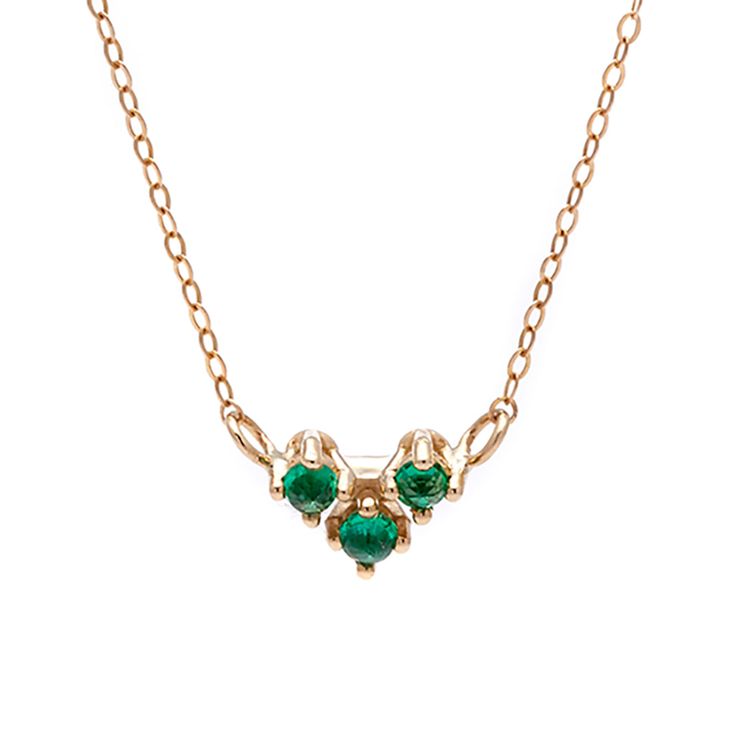 A 16" chain necklace with three emerald stones in the shape of an arrow at the base set in yellow gold. Emerald Necklace With Delicate Yellow Gold Chain, Yellow Gold Emerald Necklace With Delicate Chain, Delicate Yellow Gold Emerald Necklace, Dainty Emerald Necklace For Formal Occasions, Emerald Necklace With Delicate Chain For May Birthstone, May Birthstone Emerald Necklace With Delicate Chain, Yellow Gold Diamond Necklace For May Birthstone, Dainty Yellow Gold Emerald Necklace, Yellow Gold Emerald Necklace For May Birthstone