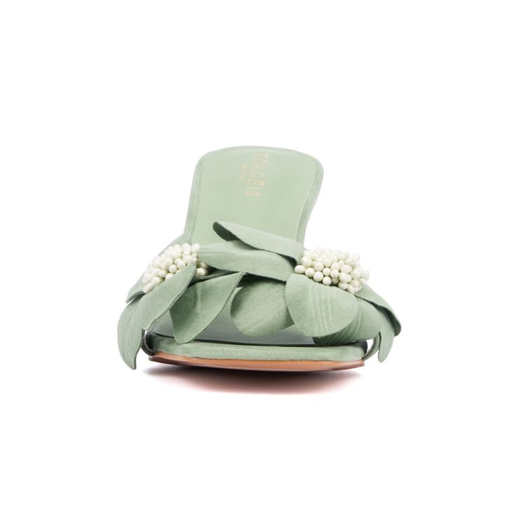 Make a statement with the Sierra heel slide, your standout piece this season. Featuring a slanted heel and oversized suede floral design adorned with bold beads, this heel is a true showstopper. Perfect for adding a touch of glamour to any outfit, the Sierra ensures you stand out with its unique and eye-catching style. Chic Green Mules For Formal Occasions, Green Open Heel Mules For Evening, Evening Green Open Heel Mules, Green Leather Mules For Party, Elegant Green Mules For Evening, Elegant Green Open Heel Mules, Spring Party Green Mules, Green Flat Heel Sandals For Evening, Green Flat Heel Evening Sandals