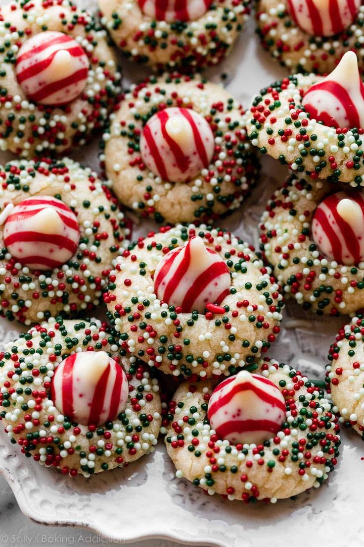 christmas sprinkle cookies are arranged on a plate