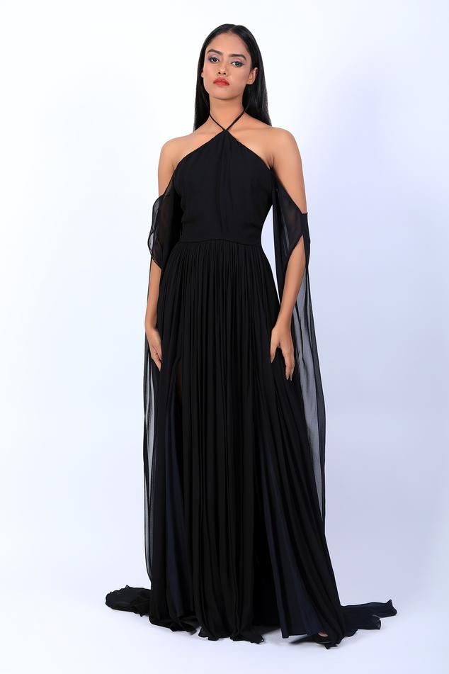 Black georgette pleated flare gown, accentuated with drape sleeves.
Components: 1
Pattern: Plain
Neckline: Halter Neck
Sleeve Type: Sleeveless
Fabric: Georgette
Color: Black
Other Details: 
Back tie-up detailing
Occasion: Party - Aza Fashions Pre-draped Evening Dress With Pleated Back For Party, Georgette Maxi Evening Dress For Banquet, Formal Georgette Maxi Dress, Pleated Back Draped Evening Dress For Party, Formal Maxi Length Georgette Evening Dress, Halter Neck Gown Indian, Georgette Maxi Evening Dress For Formal Occasions, Formal Georgette Maxi Length Evening Dress, Evening Flowy Pleated Chiffon Dress