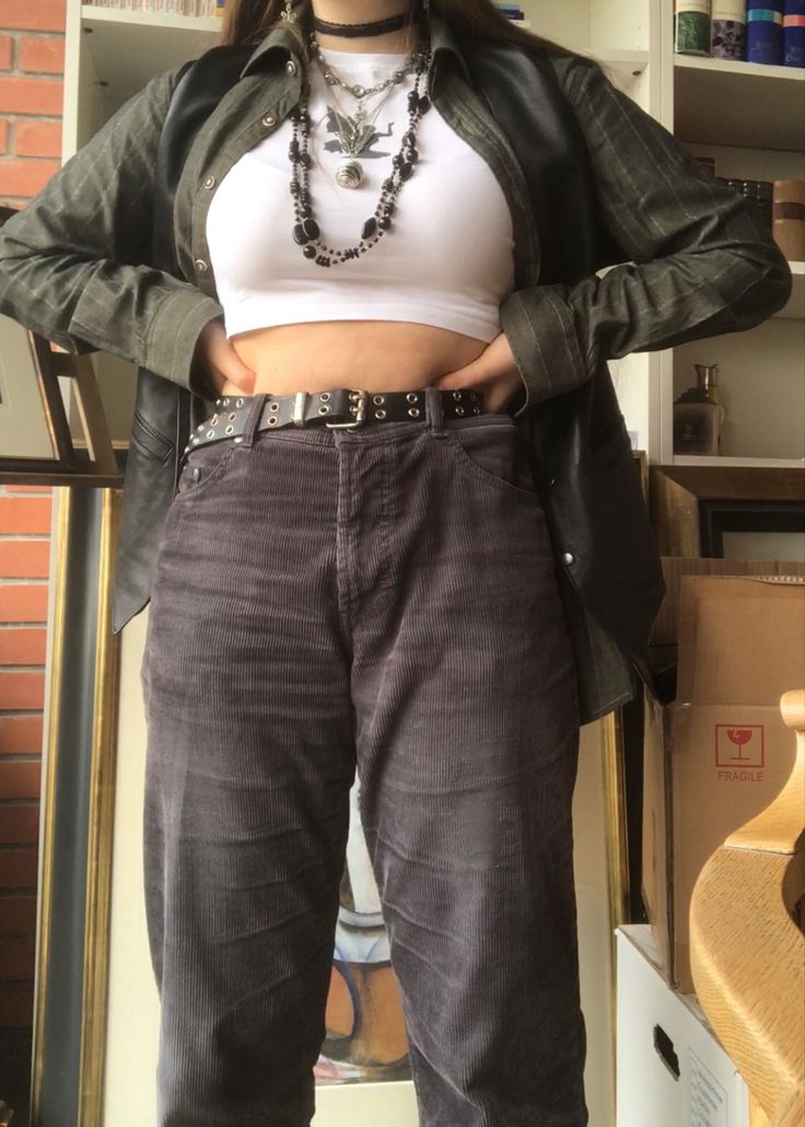 A mid-size person/girl wearing a wide black waistcoat, a thrifted dark olive green flannel under it, wide black corduroy pants, white Nike blazers and multiple crystal rings and bracelets. 	The person is also wearing multiple silver necklaces, one in form of a green crystal and another in form of a fairy  necklace, a black bead necklace, a butterfly and a black lace choker. Mid Size Flannel Outfit, Mid Sized Aesthetic, Ravencore Aesthetic Outfit, Mid Size Fairycore, Forest Green Clothes Aesthetic, Mid Size Fairy Grunge, Crystals Aesthetic Outfit, Aesthetic Mid Size Outfits, Mid Size Fashion Aesthetic