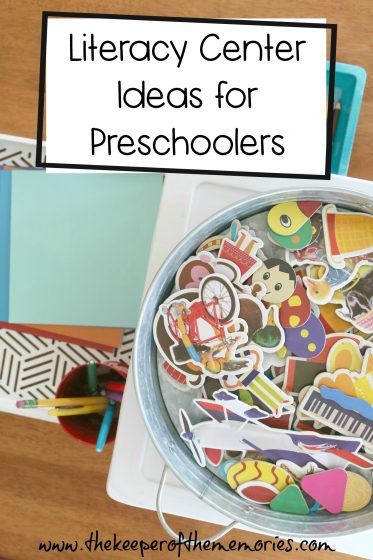 there is a bowl full of stickers on top of a desk with the words how to set up a preschool library center