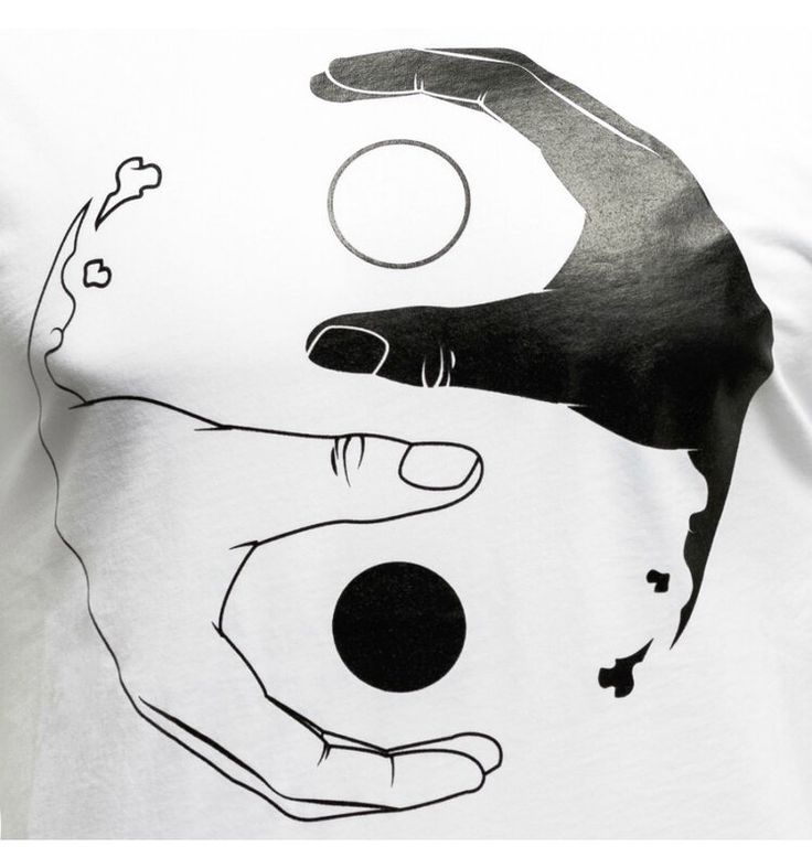 a white t - shirt with an image of two hands holding a ball