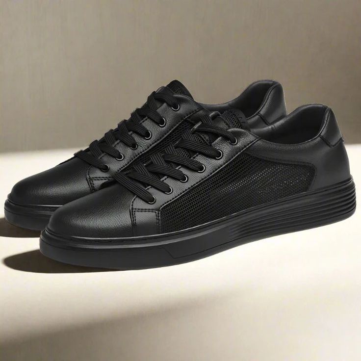 Casual Black Slip-on Sneakers With Contrast Sole, Black Perforated Sneakers For Streetwear, Leather High-top Sneakers With Perforated Toe Box For Streetwear, Black High-top Sneakers With Perforations For Streetwear, Black Perforated High-top Sneakers For Streetwear, Sporty Black Sneakers With Perforations, Black Lace-up Sneakers With Rubber Sole, Black Low-top Sneakers With Laces, Black Low-top Platform Sneakers For Streetwear