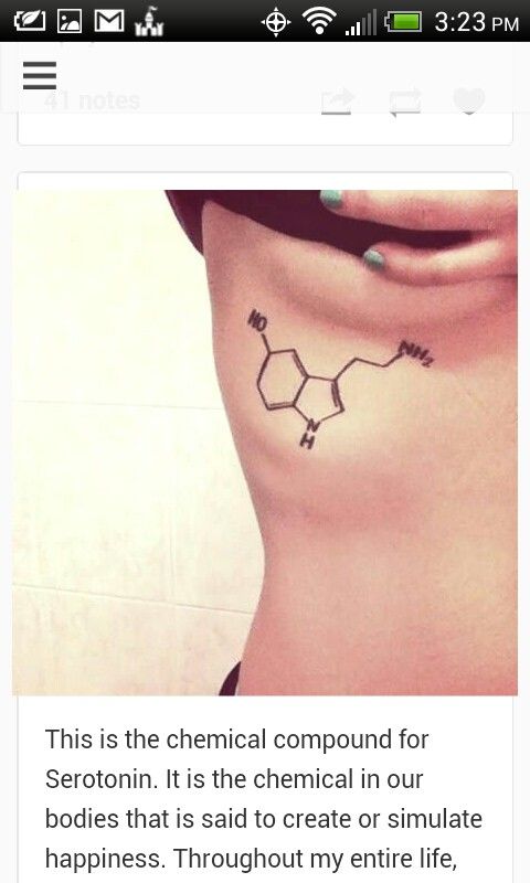 the back of a woman's stomach with chemical symbols on it