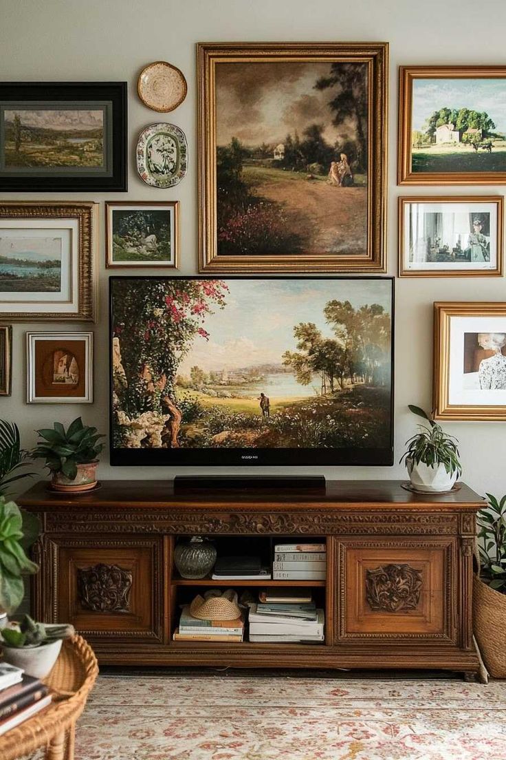 a living room filled with pictures and paintings on the wall above a flat screen tv