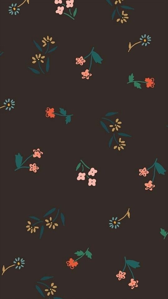 a black background with flowers and leaves on it