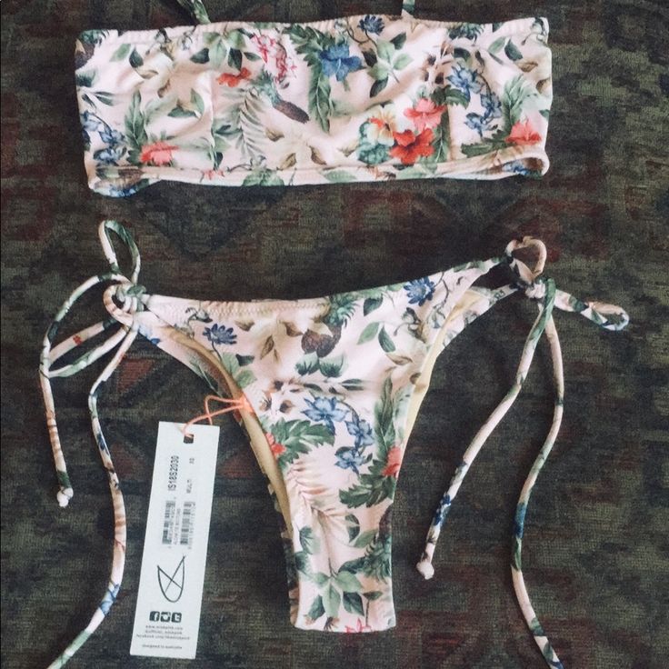 Minkpink X Revolve Brazilian String Side Tie Bottom And Smocked Back Bandeau Top Bikini Set Coord In Pink Floral Aloha Print Xs Bottom Small Top Gorgeous Floral Print Colors Removable Straps New With Tags Sold From Revolve Tags ; Onia Beach Riot Free People Loveshackfancy For Love And Lemons Swim Beach Spell & The Gypsy Spell Designs Arnhem Cleobella Surf Gypsy Boho Beach Swimsuit Swim Fl&L Beach Riot Frankie’s Bikinis Beachy Bandeau Swimwear With Floral Print, Strapless Swimwear For Spring Sunbathing, Spring Bandeau Swimwear, Strapless Swimwear For Sunbathing In Spring, Bandeau Swimwear For Spring Beach Party, Trendy Bandeau Swimwear For Spring, Strapless Summer Swimwear With Tropical Print, Beachy Bandeau Swimwear For Spring, Spring Bandeau Swimwear For Sunbathing