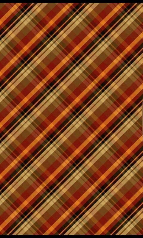 an orange and brown plaid pattern that looks like it has been made into a wallpaper