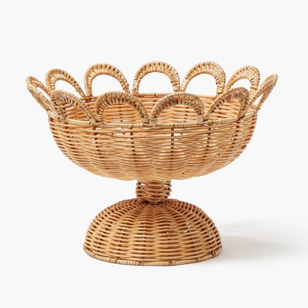 a wicker basket on a stand with handles and an oval handle is shown in front of a white background