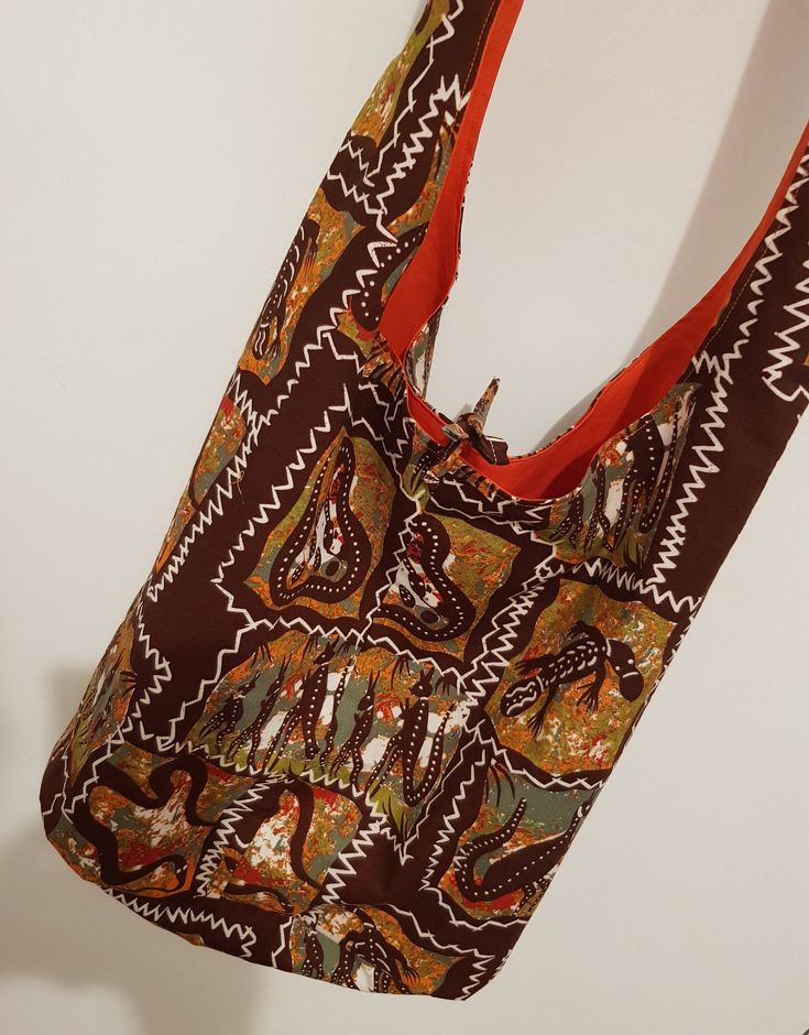 Australian animals - Boho Bag - Cross Body Bag Sling Bag - Hippie Purse -Boho Purse - Bohemian Bag - Handmade Hippie Bag Sling bag Boho cross body Australian animal print bag. Made from 100% cotton print. Soft shoulder strap, bag measures 37 inches long will hold lots. Great for note books, overnight bag. One of a kind designs no two are alike. Fully washable by hand in warm water. Thankyou for looking Bohemian Reversible Shoulder Bag, Bohemian Shoulder Bag With Long Strap, Bohemian Reversible Hobo Bag For Daily Use, Bohemian Shoulder Bag With Long Strap For Everyday Use, Bohemian Multicolor Reversible Bag, Bohemian Brown Beach Bag, Bohemian Rectangular Bag With Long Strap, Bohemian Brown Beach Bag For Daily Use, Bohemian Shoulder Bag With Long Strap For Travel