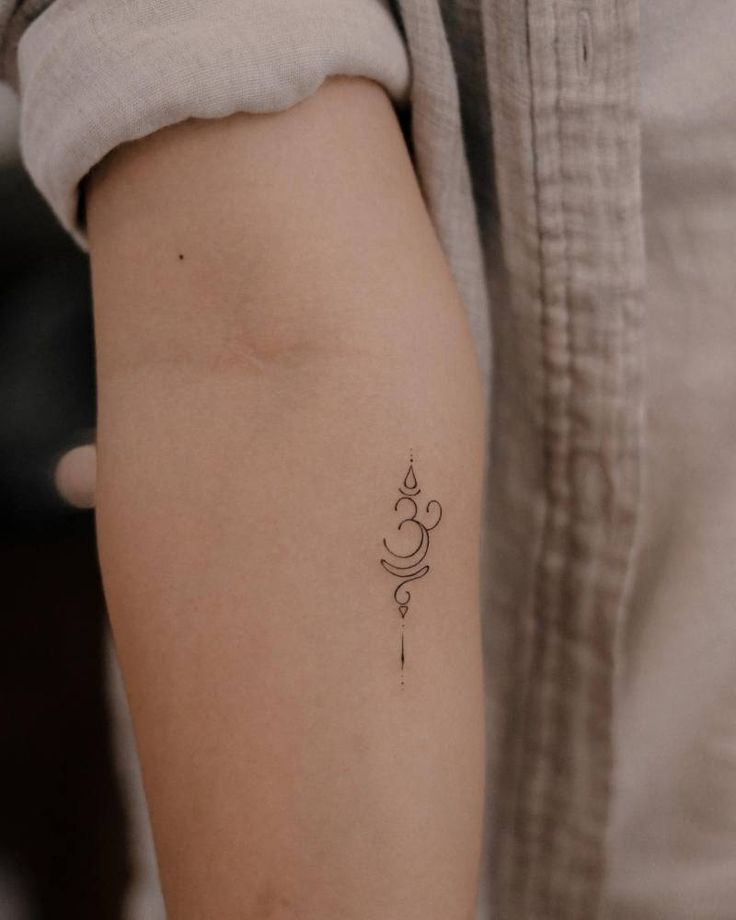 a person with a small tattoo on their arm