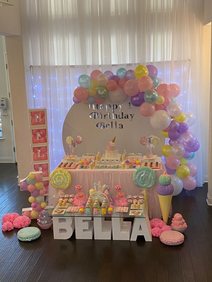 a birthday party with balloons and sweets