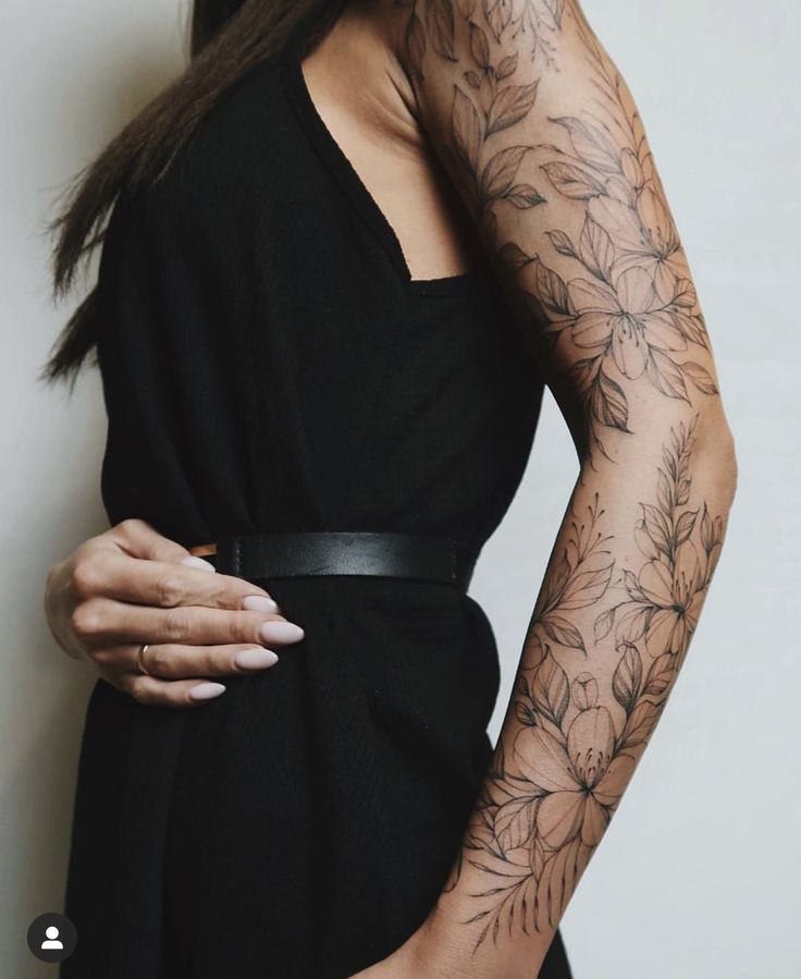 a woman with tattoos on her arms and arm