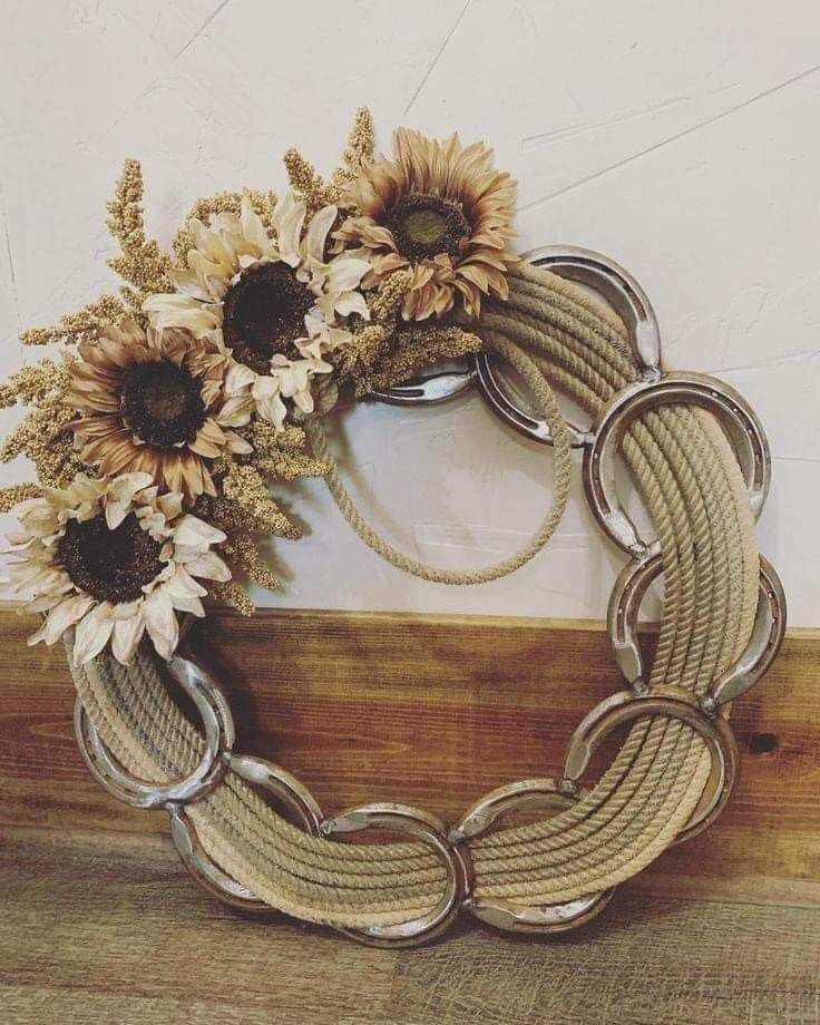 a wreath made out of rope and sunflowers