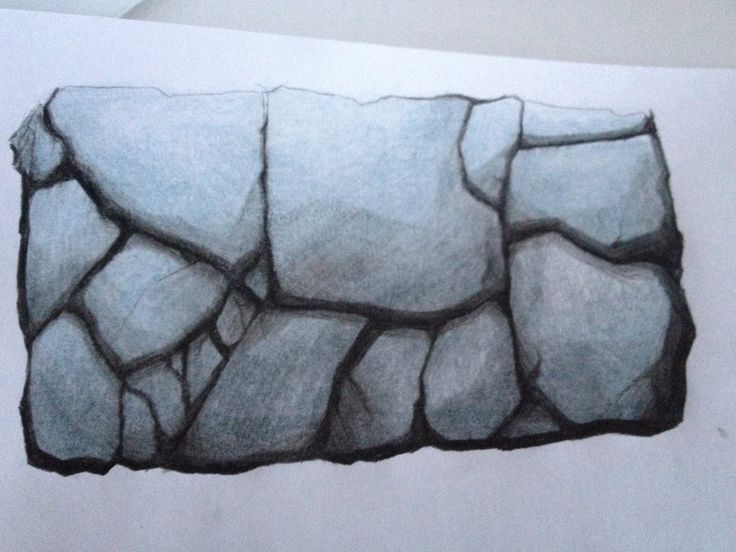 a pencil drawing of a rock formation on white paper with the image drawn in it