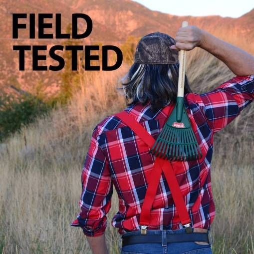 a man in plaid shirt holding a broom over his head with the words field tested on it