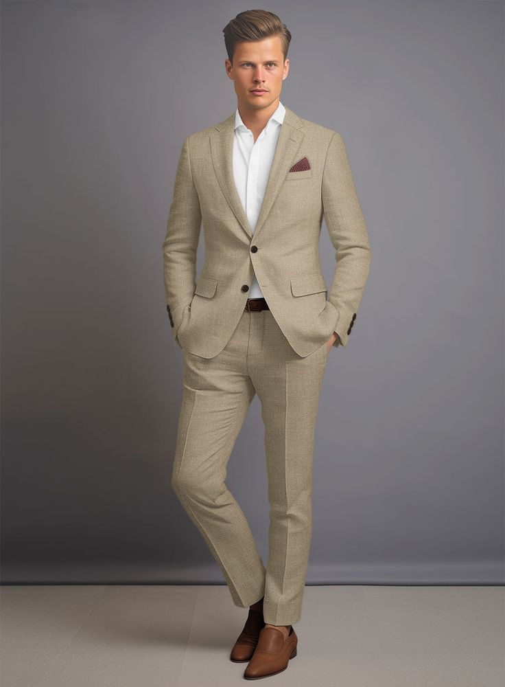 a man in a tan suit and brown shoes