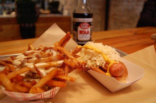 a hot dog and some french fries on a table