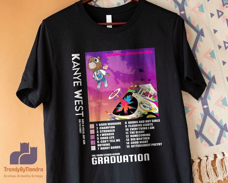 a black t - shirt with an image of a cartoon character on it