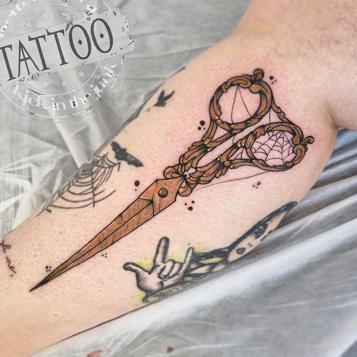 a tattoo on the leg of a person with a knife