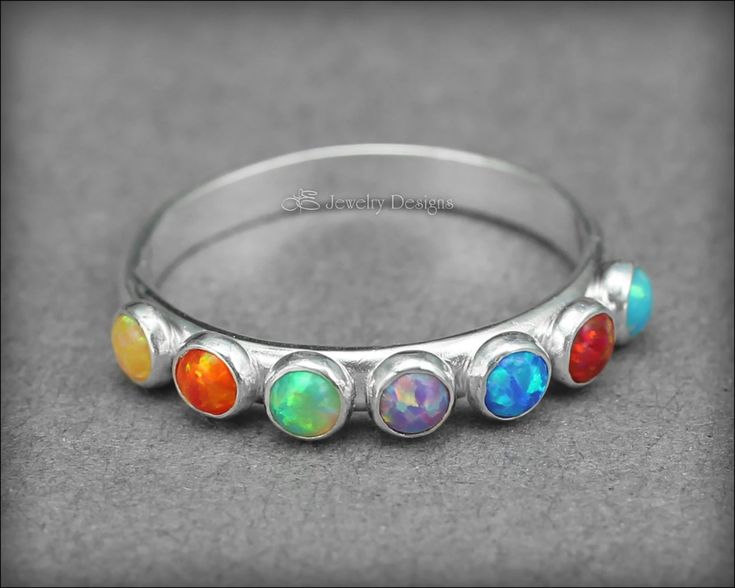 Multi Opal Ring - (choose # of opals) | LE Jewelry Designs Adjustable Cabochon Round Stone Jewelry, Adjustable Rainbow Gemstone Ring, Oval Opal Stackable Jewelry, Stackable Oval Opal Jewelry, Silver Opal Stackable Rings As Gift, Adjustable Opal Ring With Round Stone, Spiritual Opal Ring Birthstone, Spiritual Opal Ring As Birthstone, Spiritual Opal Rings