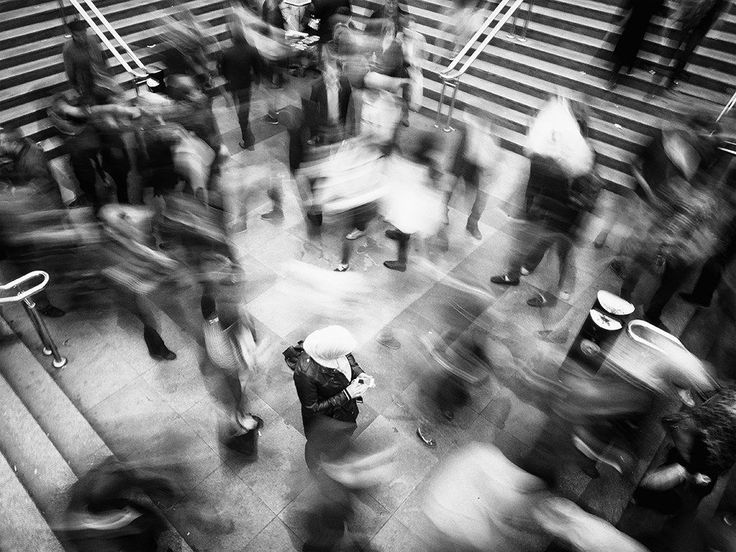 black and white photograph of people walking down stairs