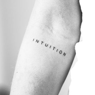 a black and white photo of a person's arm with the word institution written on it