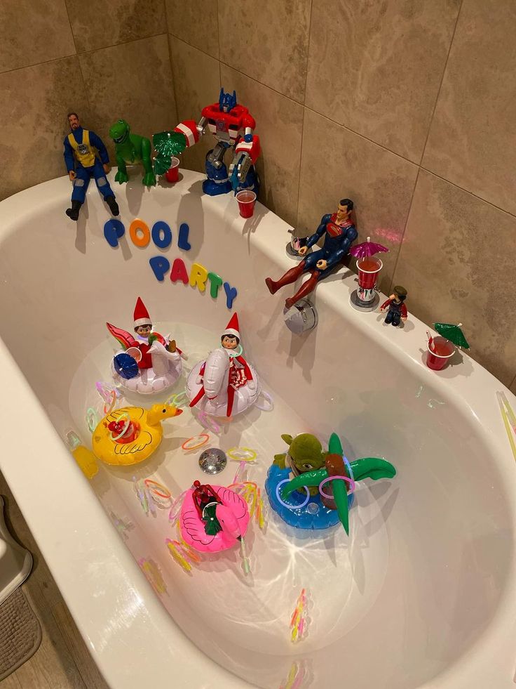 a bathtub filled with toy figures and toys in the tub for kids to play in