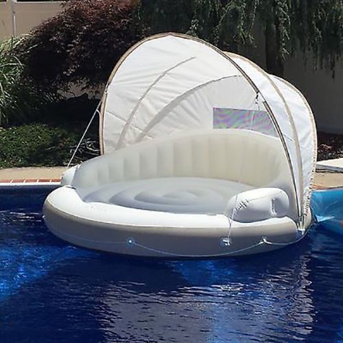 an inflatable boat floating on top of a pool