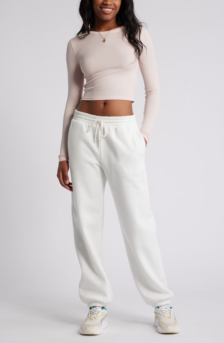 Get into cozy mode with these oversized sweatpants made with soft fleece and the essential elastic waist. Elastic/drawstring waist 68% cotton, 32% polyester Machine wash, tumble dry Imported Not available for sale and shipment to Germany Spring Sweatpants With Straight Hem, Cozy Sweatpants For Spring With Relaxed Fit, Spring Sweatpants With Elastic Cuffs For Lounging, Cozy Relaxed Fit Sweatpants For Spring, Cozy Sweatpants For Spring Lounging, Solid Color Straight Hem Sweatpants For Spring, Cozy Spring Lounging Sweatpants, Spring Sweatpants With Straight Hem And Comfortable Style, Cozy Sweatpants With Ribbed Waistband For Spring