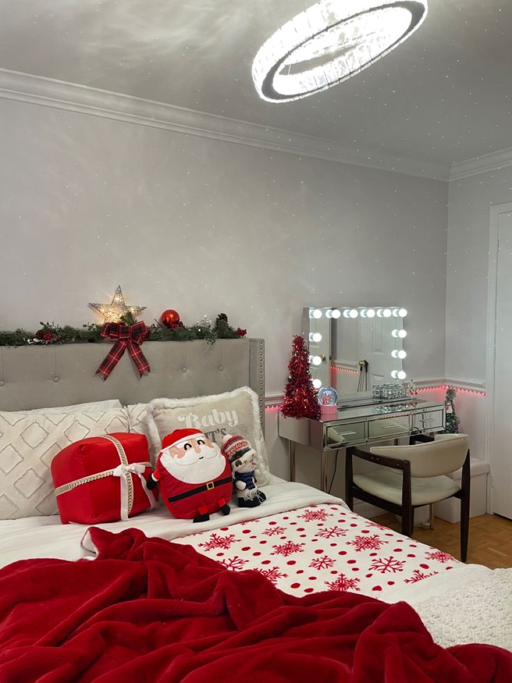 a bedroom decorated for christmas with red and white decor