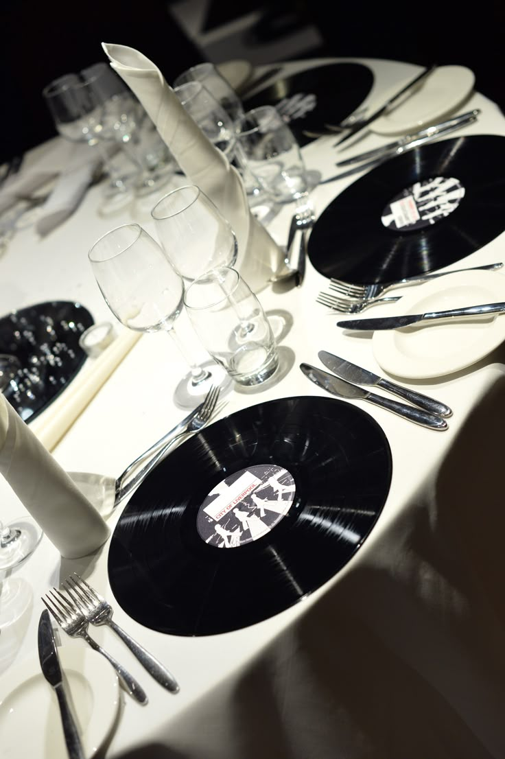 the table is set with black and white vinyl records