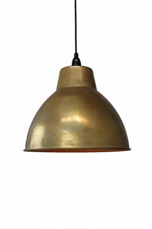 an antique brass pendant light hanging on a white wall