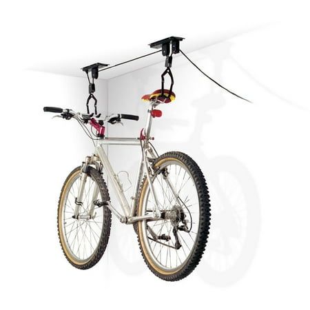 a bike hanging from the side of a wall