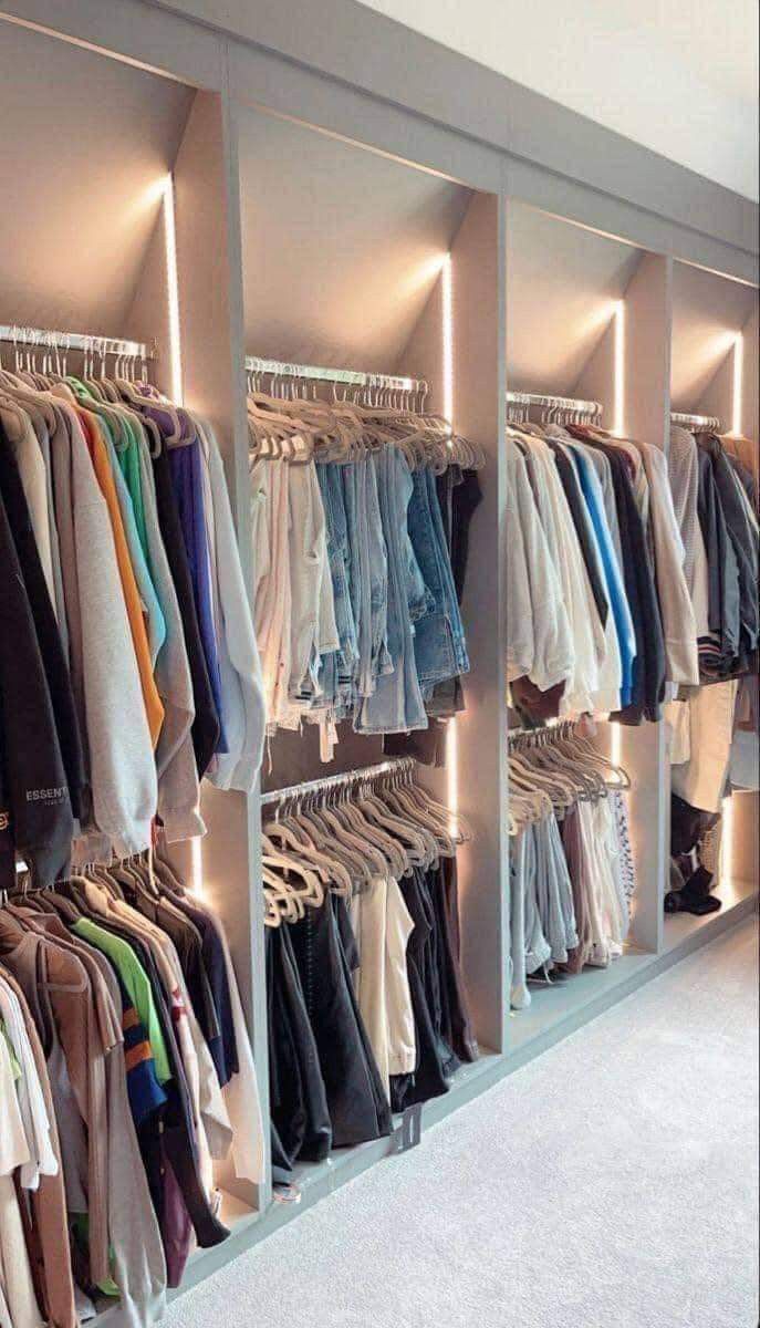 the closet is full of shirts and sweaters for men's clothing, but not for women's clothes