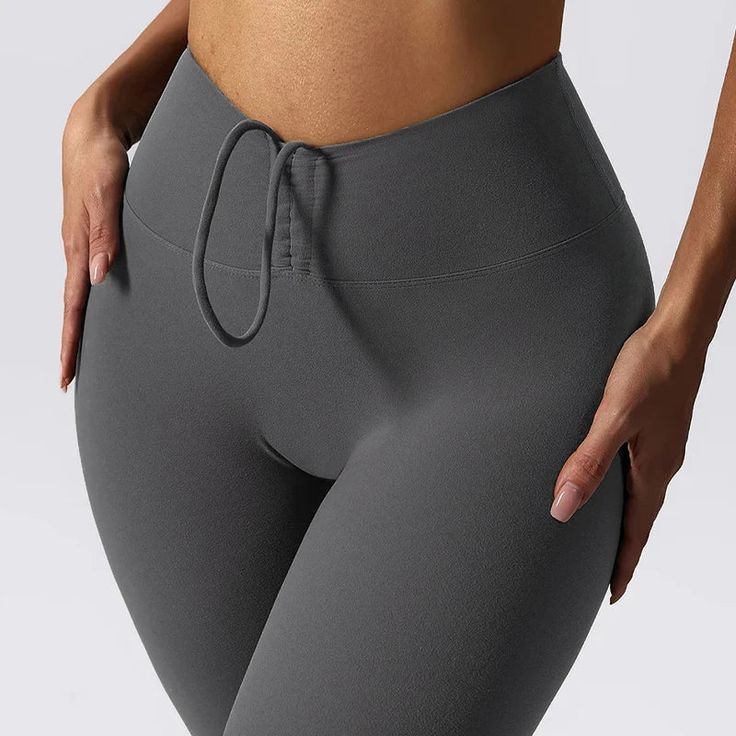 Elevate your workout wardrobe with our Push Up Booty Yoga Pants. Designed with the active woman in mind, these high-waist sports leggings combine style, comfort, and performance. Whether you're hitting the gym, going for a run, or enjoying a yoga session, these leggings will support every move you make while enhancing your silhouette. Specifications: Closure Type: Elastic Waist for a snug and secure fit Materials: Premium blend of 80% Nylon and 20% Spandex Gender: Women Item Type: Full-Length Sp High-cut Leg Athleisure For Pilates, Elastane Sweatpants For Workout, Gray Sportswear Activewear For Yoga, Gray Go-dry Activewear For Yoga, Sporty Solid Sweatpants For Yoga, Gray Elastane Activewear For Pilates, Athleisure High-cut Leg Sports Tights, Athleisure High-cut Leg Yoga Pants, High-cut Leg Athleisure Yoga Pants