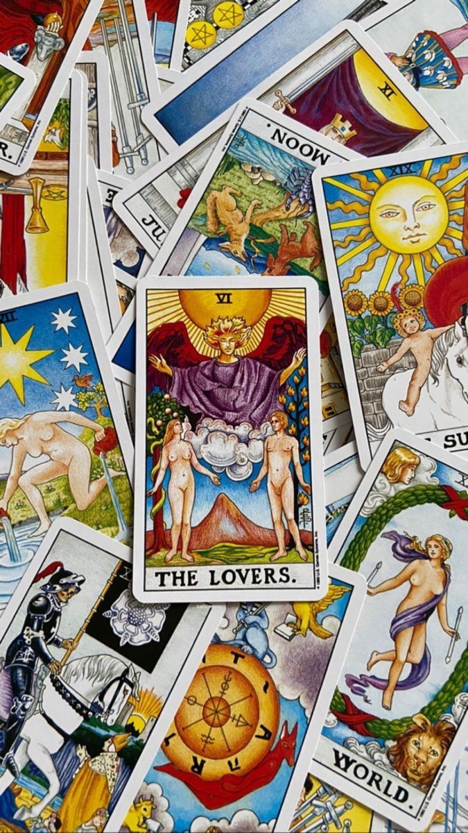 many different tarot cards spread out on top of each other