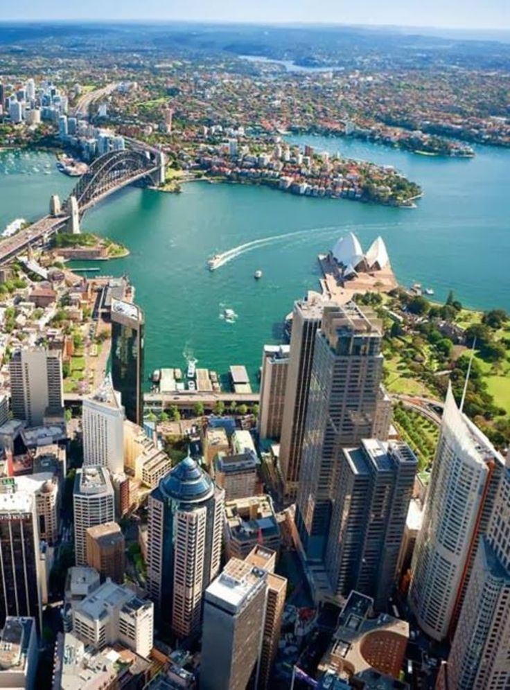 an aerial view of sydney, australia with the city and harbor in the foreground