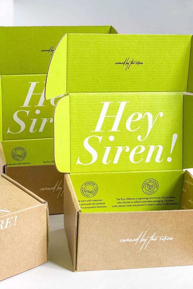 three open boxes with the words hey siren printed on them, sitting next to each other