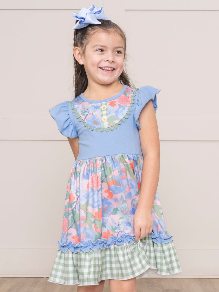 Get ready to turn heads in this playful Olive & Blue Watercolor Florals Ruffle Dress. The unique combination of olive gingham and watercolor florals will make your little stand out in any crowd. And with ruffles adding a touch of whimsy, she'll feel confident and stylish wherever she goes. Shop the sibling set! Fits true to size. Body: 97% Cotton / 3% Spandex Combo: 95% Polyester / 5% Spandex Accessories sold separately. Suggest bow color #61 and #66. Import. Henley is 46 inches tall and 52 lbs Ruffled Short Sleeve Twirl Dress For Garden Party, Short Sleeve Ruffled Twirl Dress For Garden Party, Spring Playtime Dress With Ruffle Hem, Playful Ruffled Twirl Dress For Summer, Cute Spring Twirl Dress For Playwear, Playful Spring Twirl Dress With Ruffle Hem, Spring Flutter Sleeve Twirl Dress For Playdate, Whimsical Multicolor Twirl Dress For Spring, Whimsical Summer Twirl Dress For Playdate